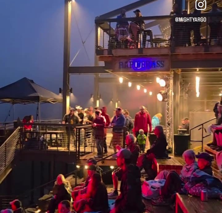 The Argo amphitheater stage with full PA &mdash; mains and monitors, mountain views